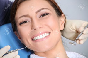dental examination of attractive girl in the office of the dentist